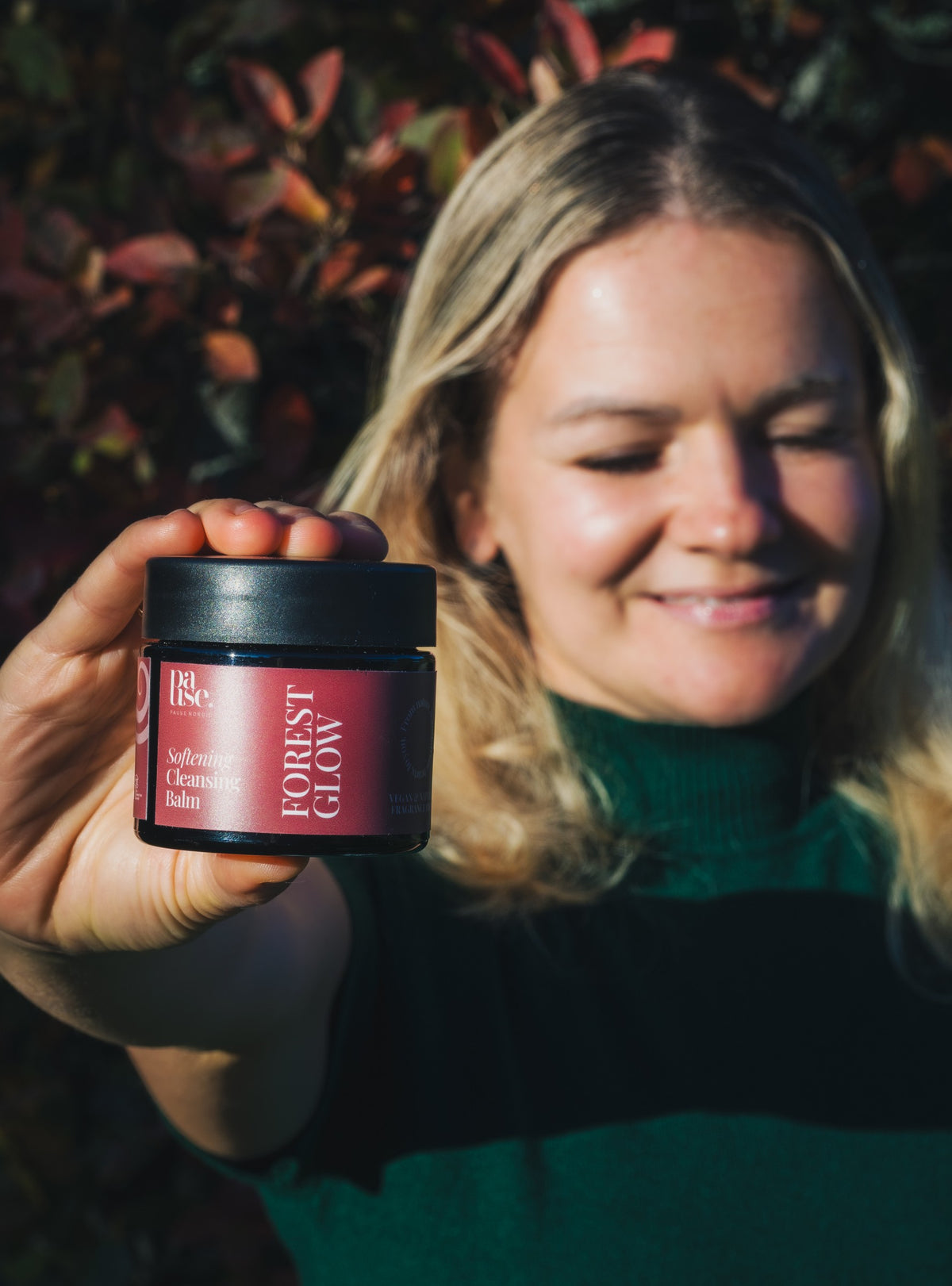 Pause Nordic Cleansing Balm in its new Forest Glow packaging held outdoors