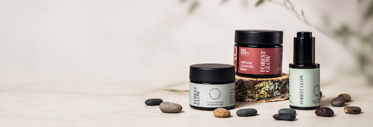 Pause Nordic Cleansing Balm, Serum and Face Cream on a warm ivory studio background