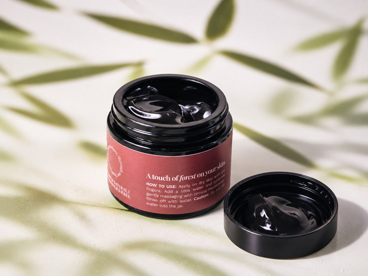 Open Pause Nordic Cleansing Balm jar and lid showing the balm texture