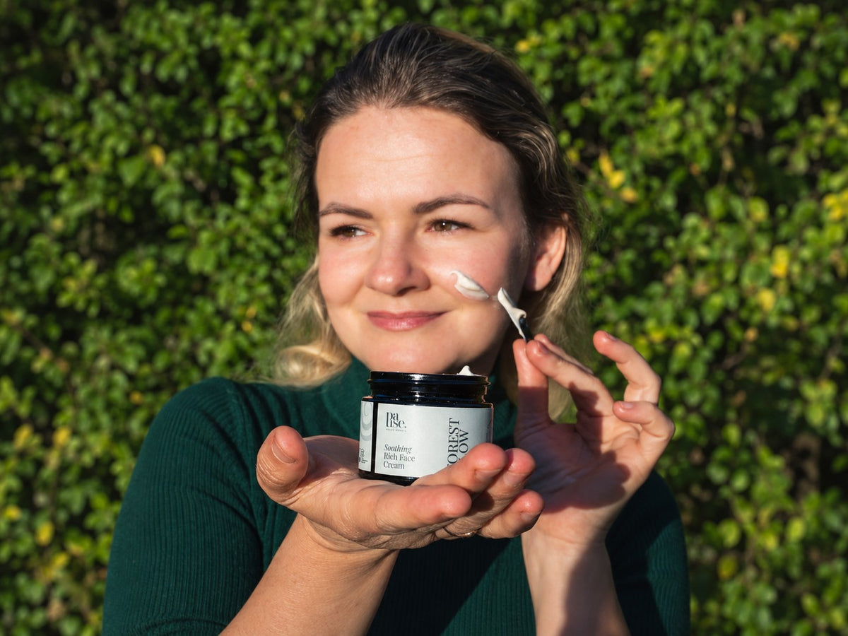 Applying Pause Nordic Face Cream outdoors